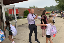 Mr. Issler greeting students