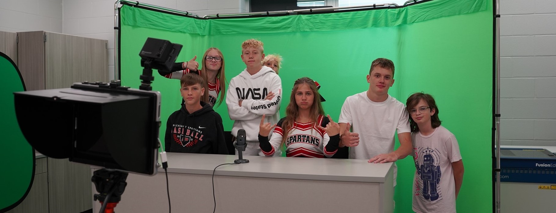 news time!  students in front of the green screen